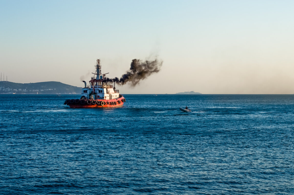 coast,guard,vessel,emitting,black,smoke,cruising,in,istanbul,bosphorus